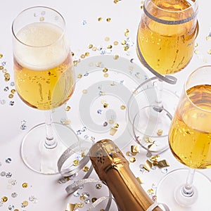 festive champagne glasses with bottle ready for new year