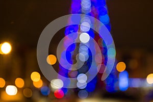 Blurred colored circles on a light holiday background