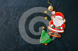 Festive Christmas background, Cookies with image of Santa, fir t