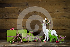 Festive christmas background with presents and reindeer in red a