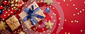 Festive Christmas Background with Wrapped Gifts, Golden Decorations, and Sparkling Stars on Red