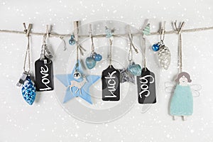 Festive christmas card in light blue and white colors with text.