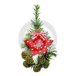 Festive christmas decoration, fir tree branch with cones and wooden toy, red star, on isolated background.