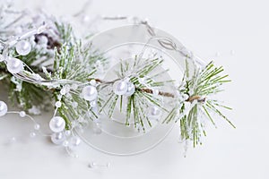 Festive Christmas decoration with pine branch and white pearls g