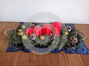 Festive Christmas decoration table with red candles, handmade work