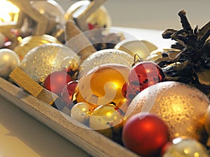Festive Christmas decorations on a white table, selective focus on foreground