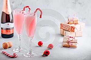 Festive Christmas drink Peppermint Bark Mimosa cocktail with champagne or prosecco and candy cane