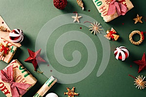 Festive Christmas gift boxes adorned with vintage decorations on a green background