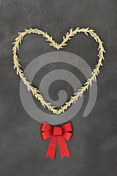 Festive Christmas Gold Heart Wreath and Red Bow