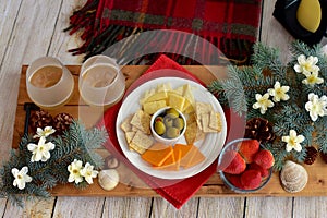 Festive Christmas holiday decor and celebratory drinks and appetizers to celebrate the winter solstice holidays