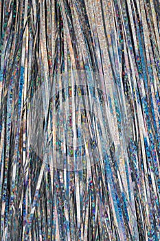 Festive Christmas Lametta Texture Background with Shiny Silver Tinsel