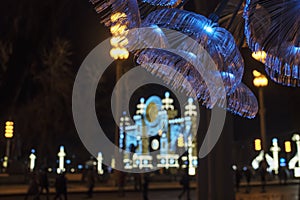 Festive christmas lights in night city park