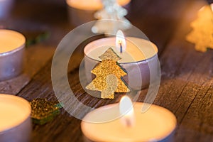 Festive Christmas mood with burning candle flames and ornaments