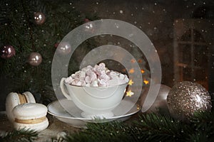 Festive Christmas New Year still life composition hot drink mug with marshmallow, french macaroon, macaron