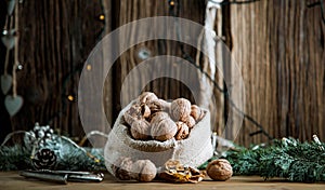 festive christmas nuts tumbling from a burlap bag