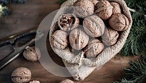 festive christmas nuts tumbling from a burlap bag