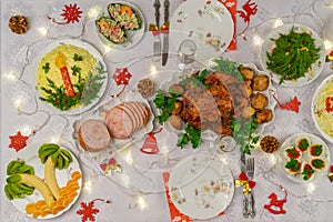 Festive Christmas served table with delicious food and decorative items. Dinner for New Year party, Christmas turkey. Winter