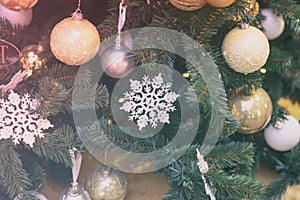 Festive christmas tree with snowflakes, colorful balls, garlands, decorations. Selective focus. Abstract background for