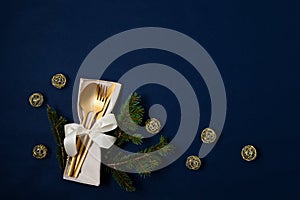 Festive christmas, wedding, birthday table setting with golden cutlery. Mockup for place card, dinner invitation