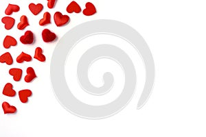 Festive composition from red hearts scattered and isolated on white background, valentines day concept, copy space