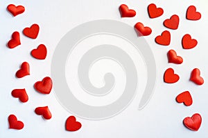 Festive composition from red hearts scattered on white background, valentines day concept, copy space for text