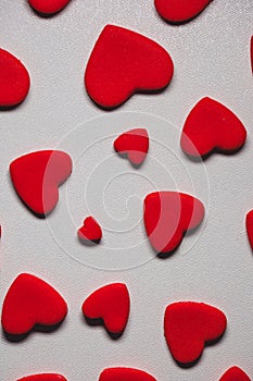 Festive composition from sugar red hearts scattered and isolated on white background. Valentine, love, wedding, marriage concept