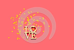 Festive coral background with spangles in the shape of heart