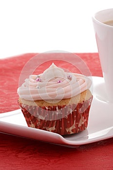 Festive cupcake with tea on fancy plate