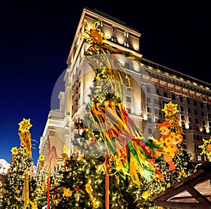 Festive decoration of the traditional holiday Shrovetide near the Kremlin walls on Manezhnaya Square in Moscow.