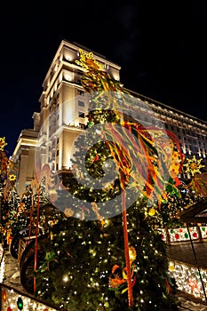 Festive decoration of the traditional holiday Shrovetide near the Kremlin walls on Manezhnaya Square in Moscow.