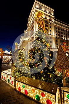 Festive decoration of the traditional holiday Shrovetide near the Kremlin walls on Manezhnaya Square in Moscow.