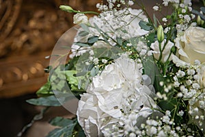 Festive decoration for wedding event. Flower arrangements predominantly white and green