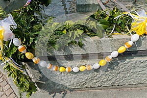 Festive decorations for Easter holiday on the village fountains of the small town of Maienfeld in the Swiss Alps