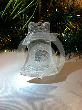 Festive decorative Christmas tree toy made of frosted glass in the form of a bell