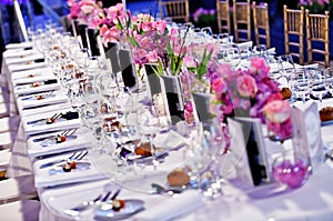 Festive dinner table with beautiful flowers bouquets