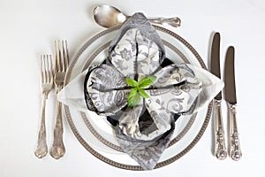 Festive dinner table in silver and grey