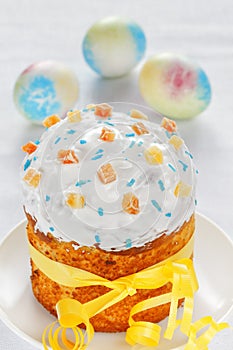 Festive Easter cake and Easter eggs. High key. Close-up