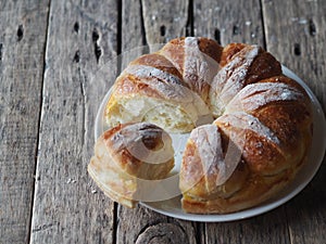 Festive Easter, Christmas or everyday bread rolls on a wooden rustic ancient table.Homemade cake