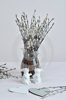 Festive Easter spring composition with pussy willow branches with catkins and eggs.Easter Background. Springtime. Invitation card