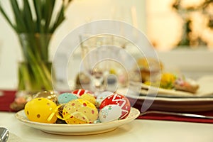 Festive Easter table setting with decorated eggs