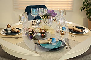 Festive Easter table setting with decorated eggs