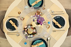 Festive Easter table setting with decorated eggs