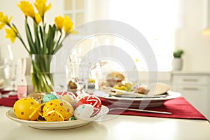 Festive Easter table setting with decorated eggs