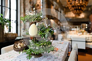 Festive Easter Table Setting with Decorative Eggs and Spring Flowers