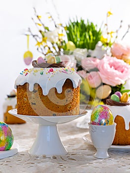 Festive Easter table setting. Easter cake, Easter Eggs, Flower arrangements and home decorations for holiday