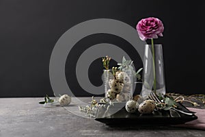 Festive Easter table setting with quail eggs and floral decoration on background. Space for text