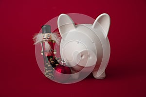 Festive financial savings concept. Piggy bank with Christmas decorations