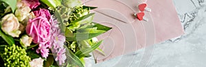 Festive flat lay arrangement of pale pink roses,white eustoma, envelope, hearts.Holiday card Festive mock up