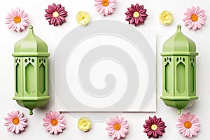 Festive flatlay with green lanterns, flowers, and blank card