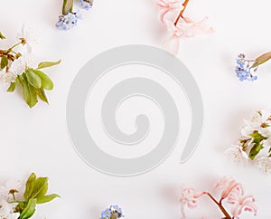 Festive flower composition on the white wooden background. Overhead view